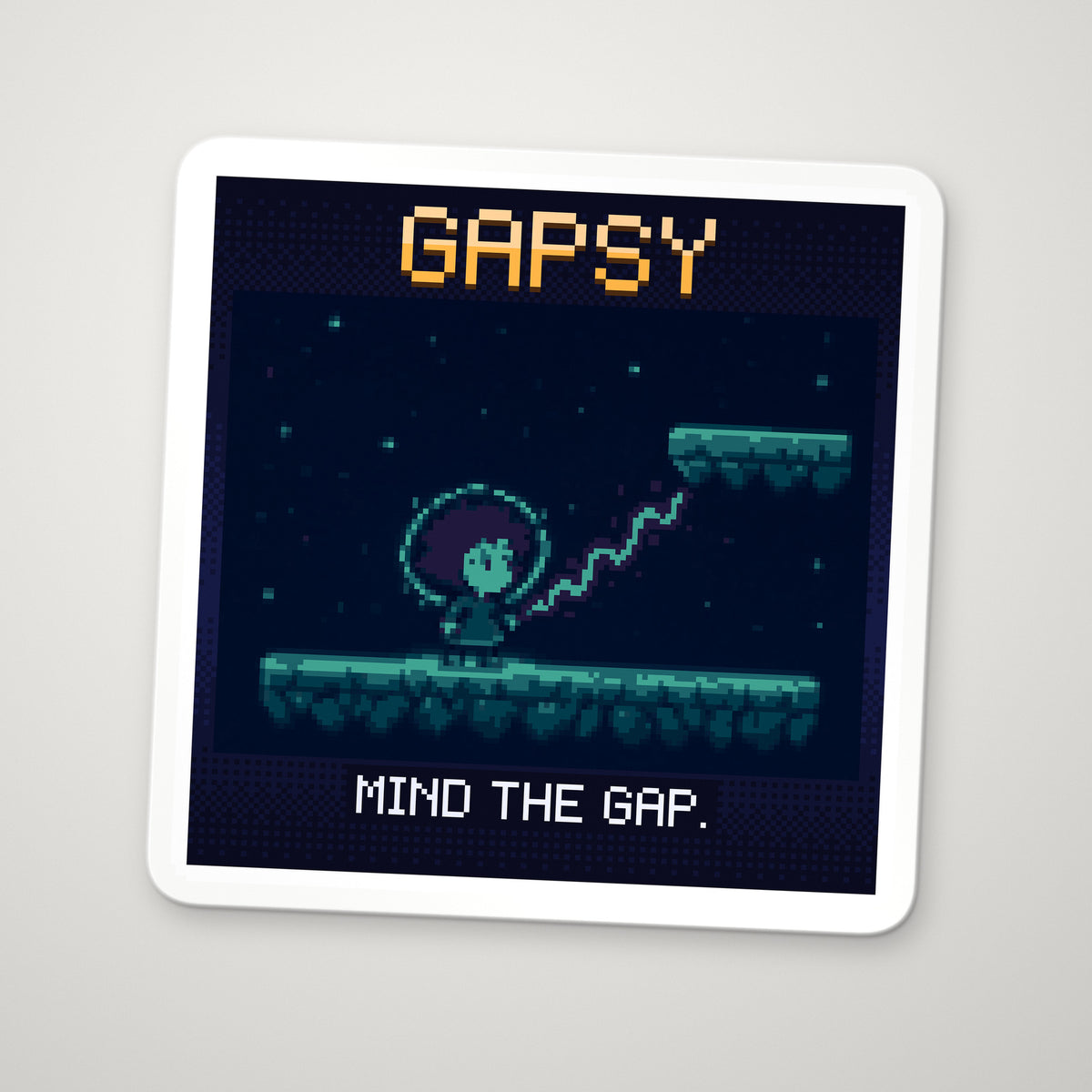 Pixel-art sticker of Gapsy, personifying Band Gap, with the caption "Mind The Gap."