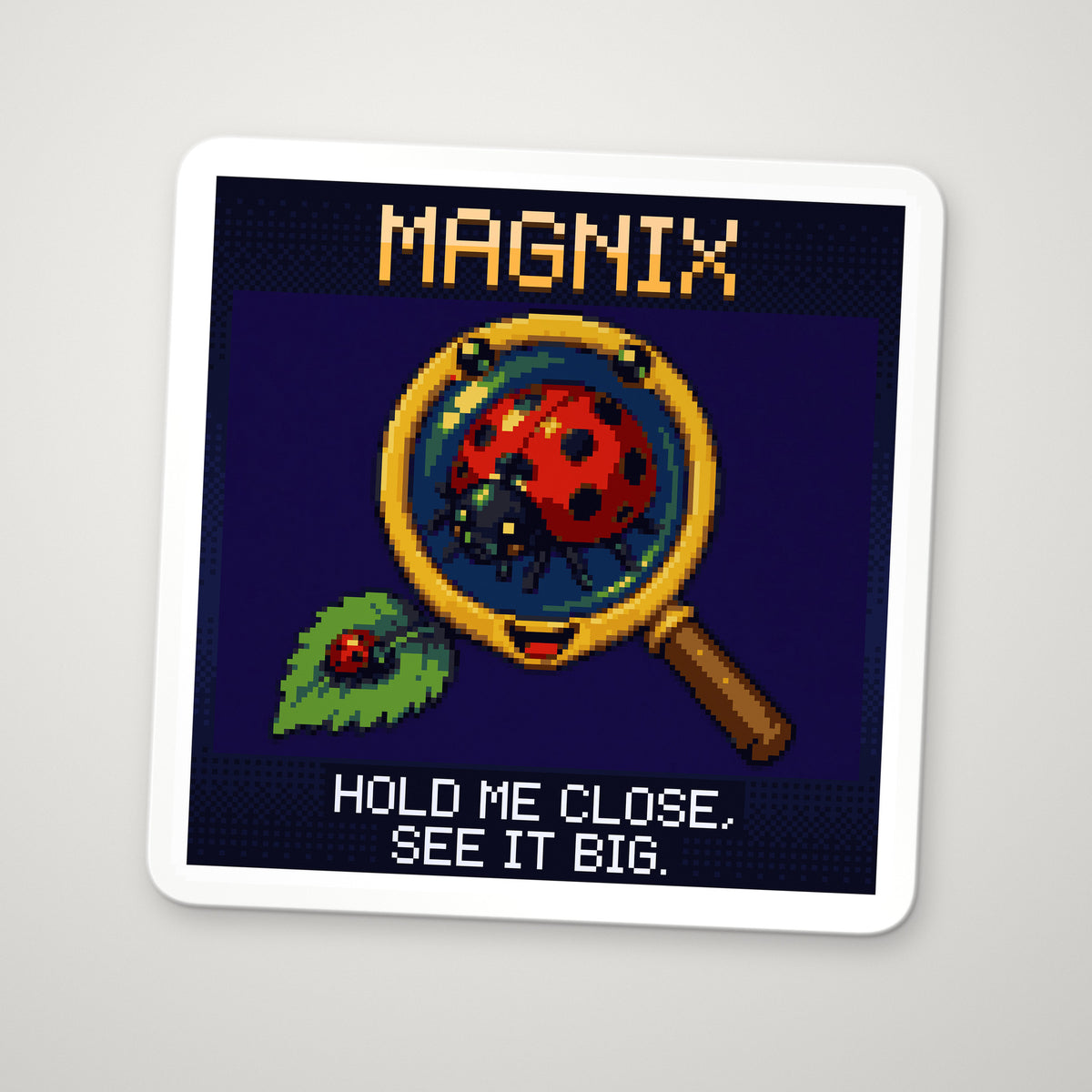 Pixel-art sticker of Magnix, personifying Simple Magnifier, with the caption “Hold Me Close, See It Big.”