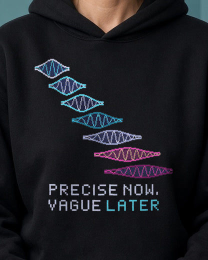 Black Wave Packet physics hoodie, pixel-art free wave packet spreading design, worn by a model, front close-up