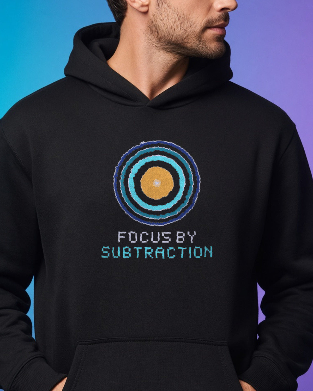 Black Zone Plate physics hoodie, pixel-art Fresnel zone plate design, worn by a model, front close-up
