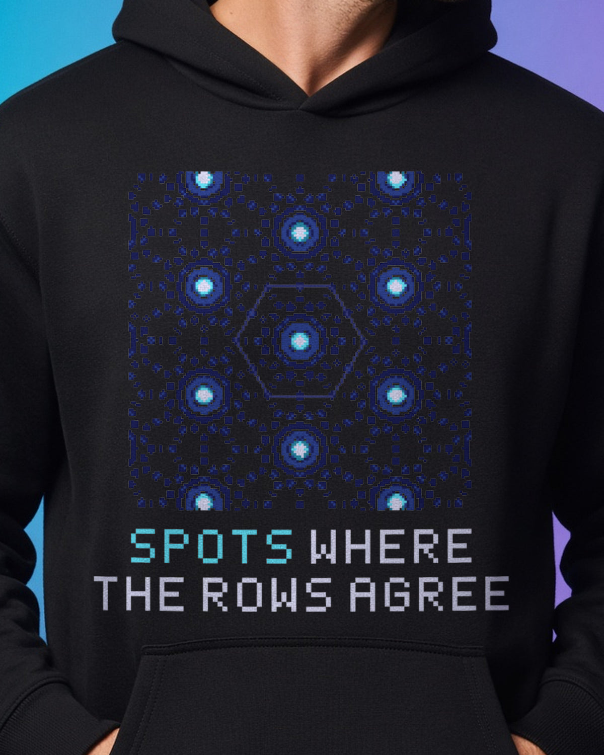 Black Diffraction physics hoodie, pixel-art crystal diffraction design, worn by a model, front close-up