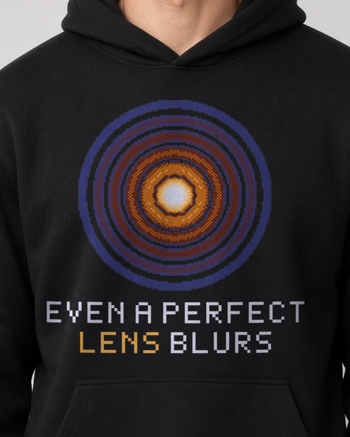 Black Airy Disk physics hoodie, pixel-art Airy diffraction pattern design, worn by a model, front close-up