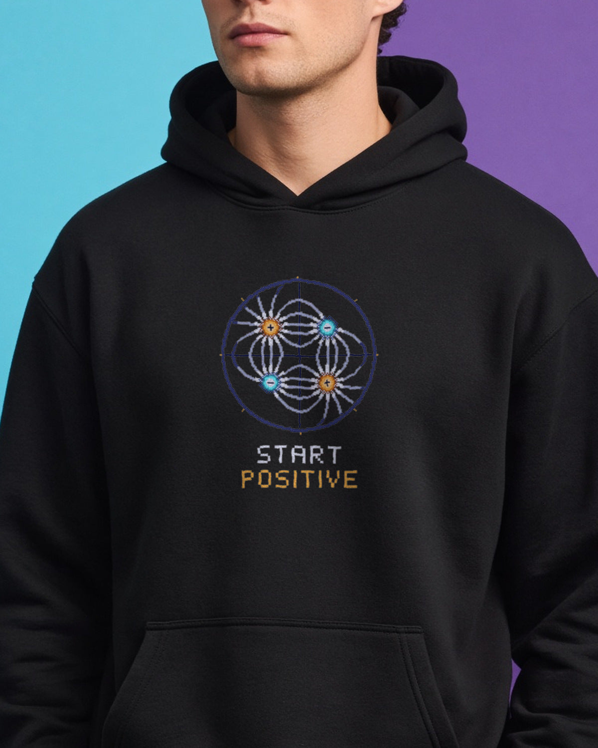 Black Field Lines physics hoodie, pixel-art electric quadrupole field design, worn by a model, front close-up