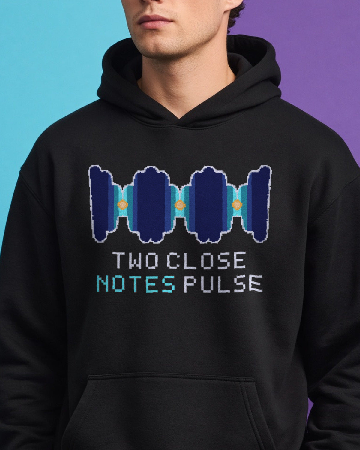 Black Beats physics hoodie, pixel-art acoustic beats from two close tones design, worn by a model, front close-up