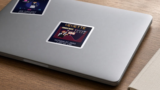Vevette navy pixel-art physics sticker, Higgs field, on a laptop