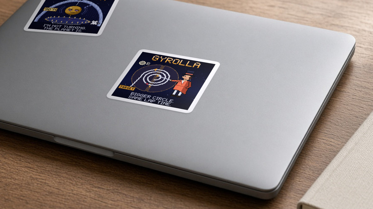 Gyrolla navy pixel-art physics sticker, cyclotron motion, on a laptop