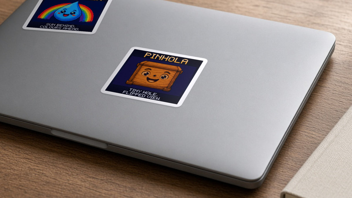 Pinhola pixel-art physics sticker on a laptop
