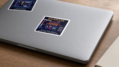 Invertia navy pixel-art physics sticker, negative temperature, on a laptop