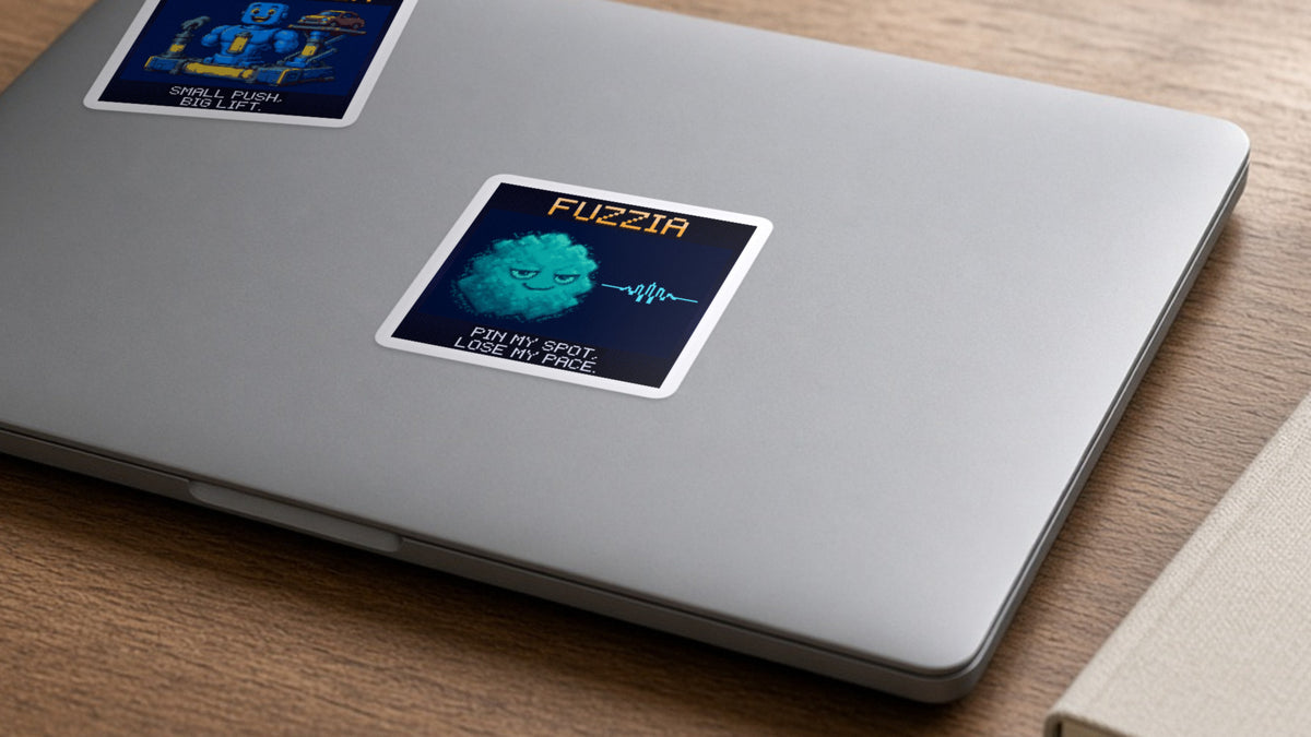 Fuzzia pixel-art physics sticker on a laptop
