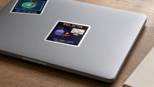 Relicta navy pixel-art physics sticker, cosmic microwave background, on a laptop
