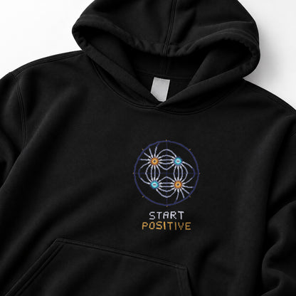 Black Field Lines physics hoodie, pixel-art electric quadrupole field design, front view