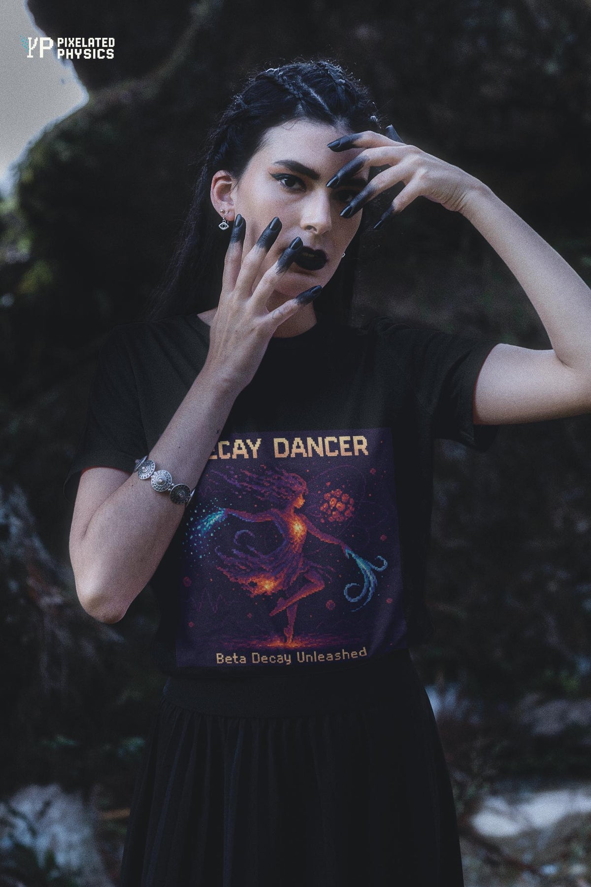 Black Decay Dancer physics T-shirt, pixel-art beta decay design, worn by a woman