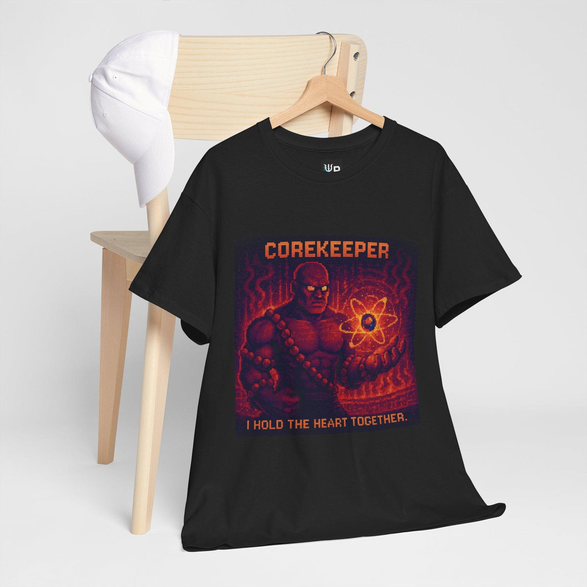 Black Corekeeper physics T-shirt, pixel-art strong nuclear force design, hanging on a chair