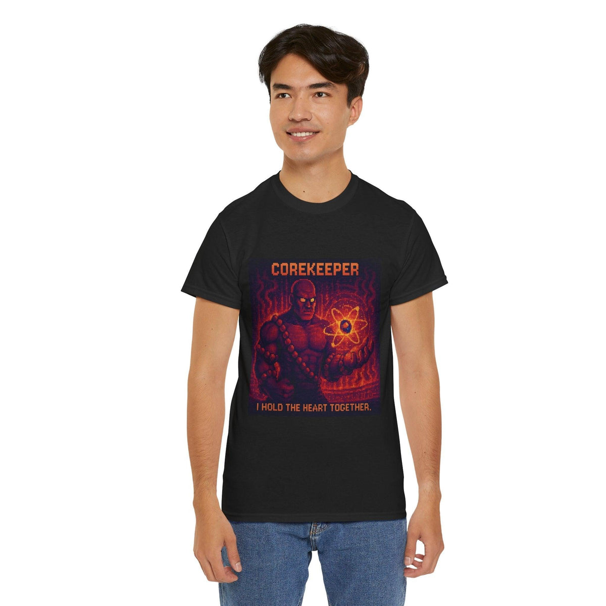 Black Corekeeper physics T-shirt, pixel-art strong nuclear force design, worn by a man