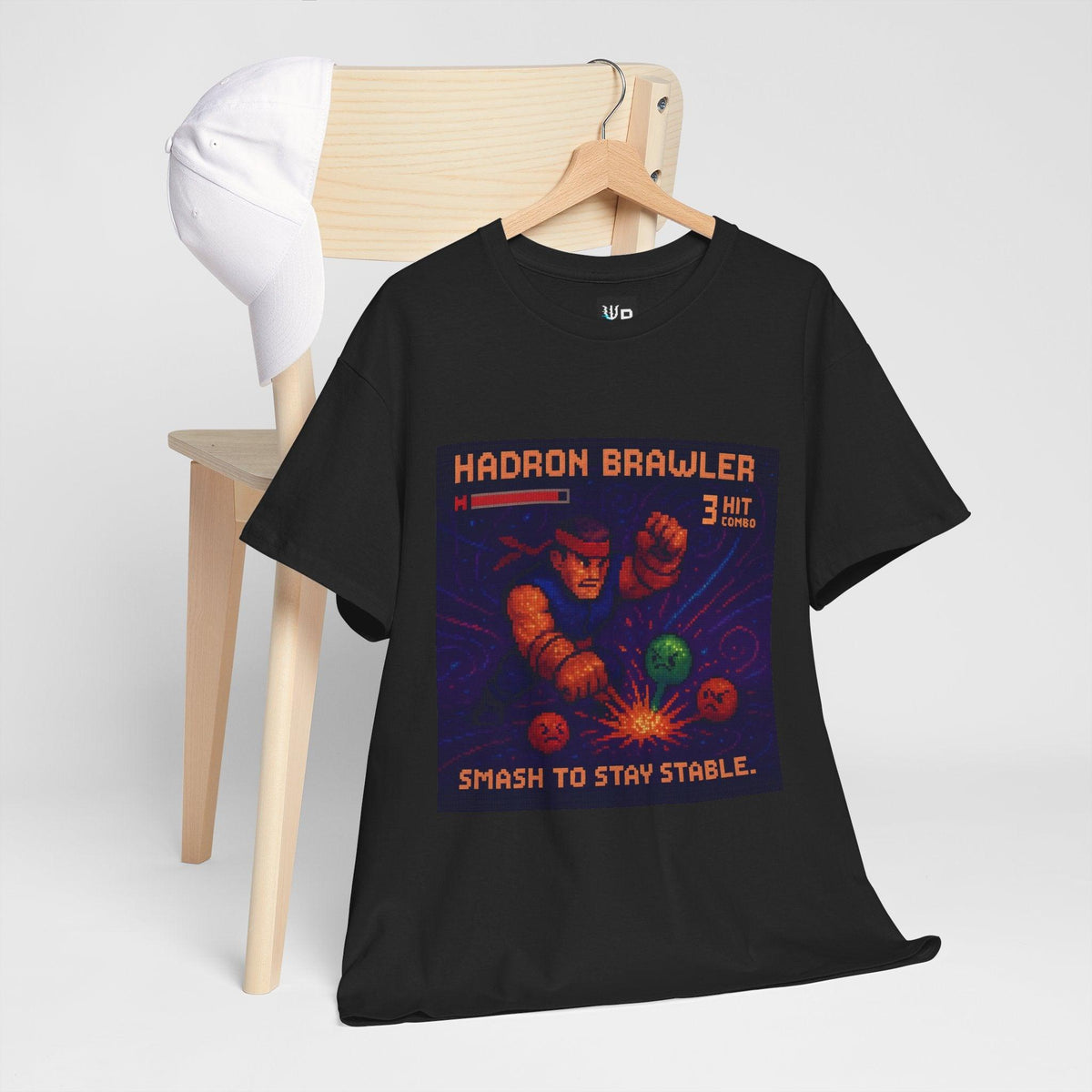 Black Hadron Brawler physics T-shirt, pixel-art strong force, quark confinement design, hanging on a chair