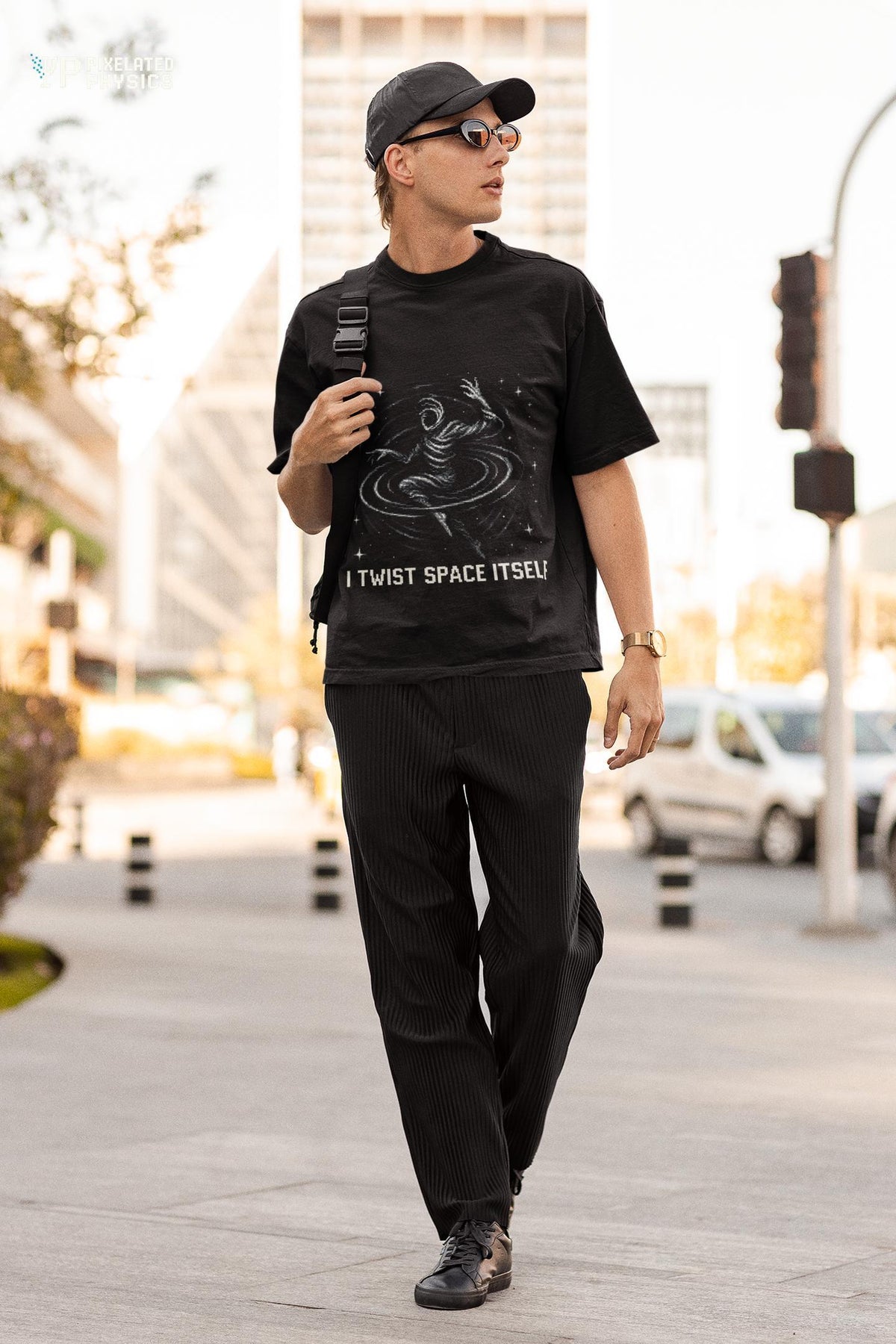 Black I Twist Space Itself physics T-shirt, pixel-art gravitational lensing design, worn by a man walking