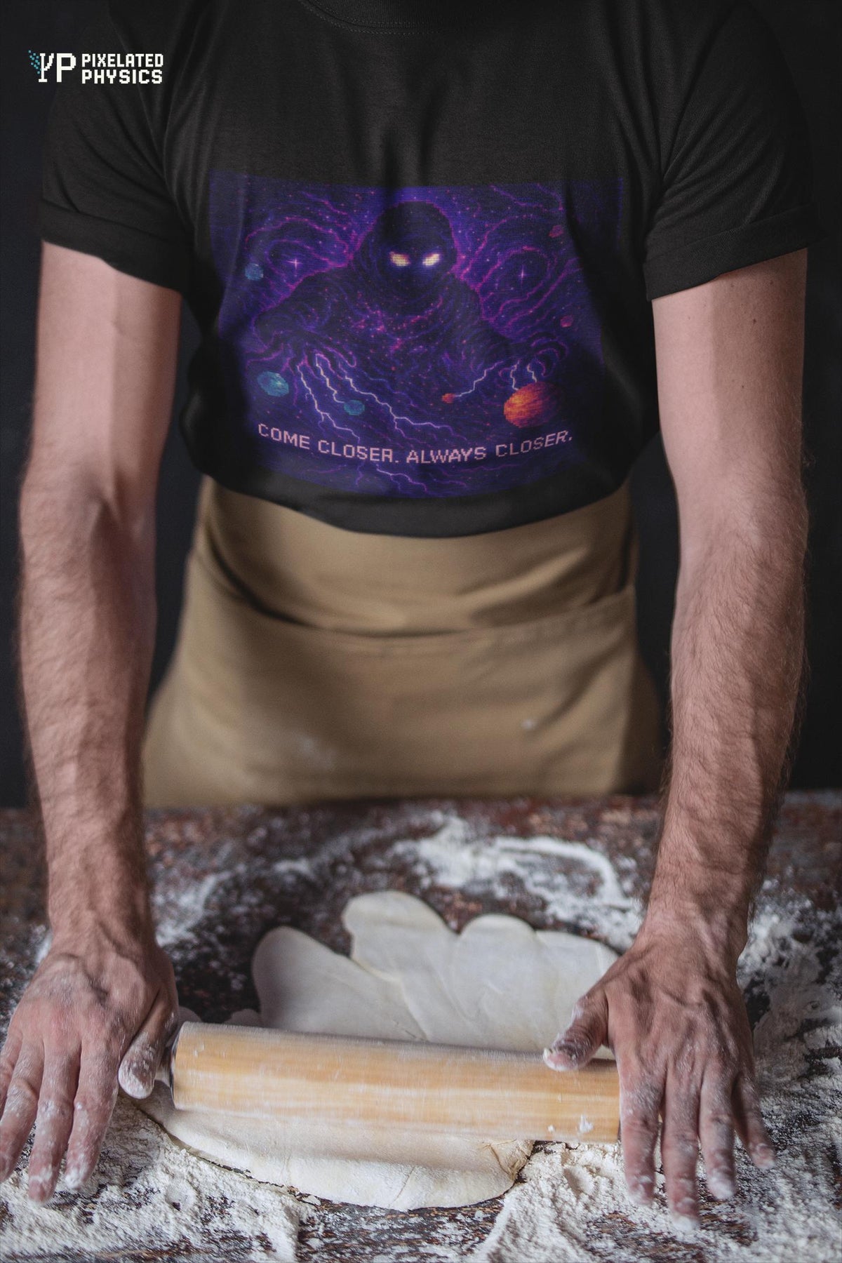Black The Lurker physics T-shirt, pixel-art general relativity design, worn by a man