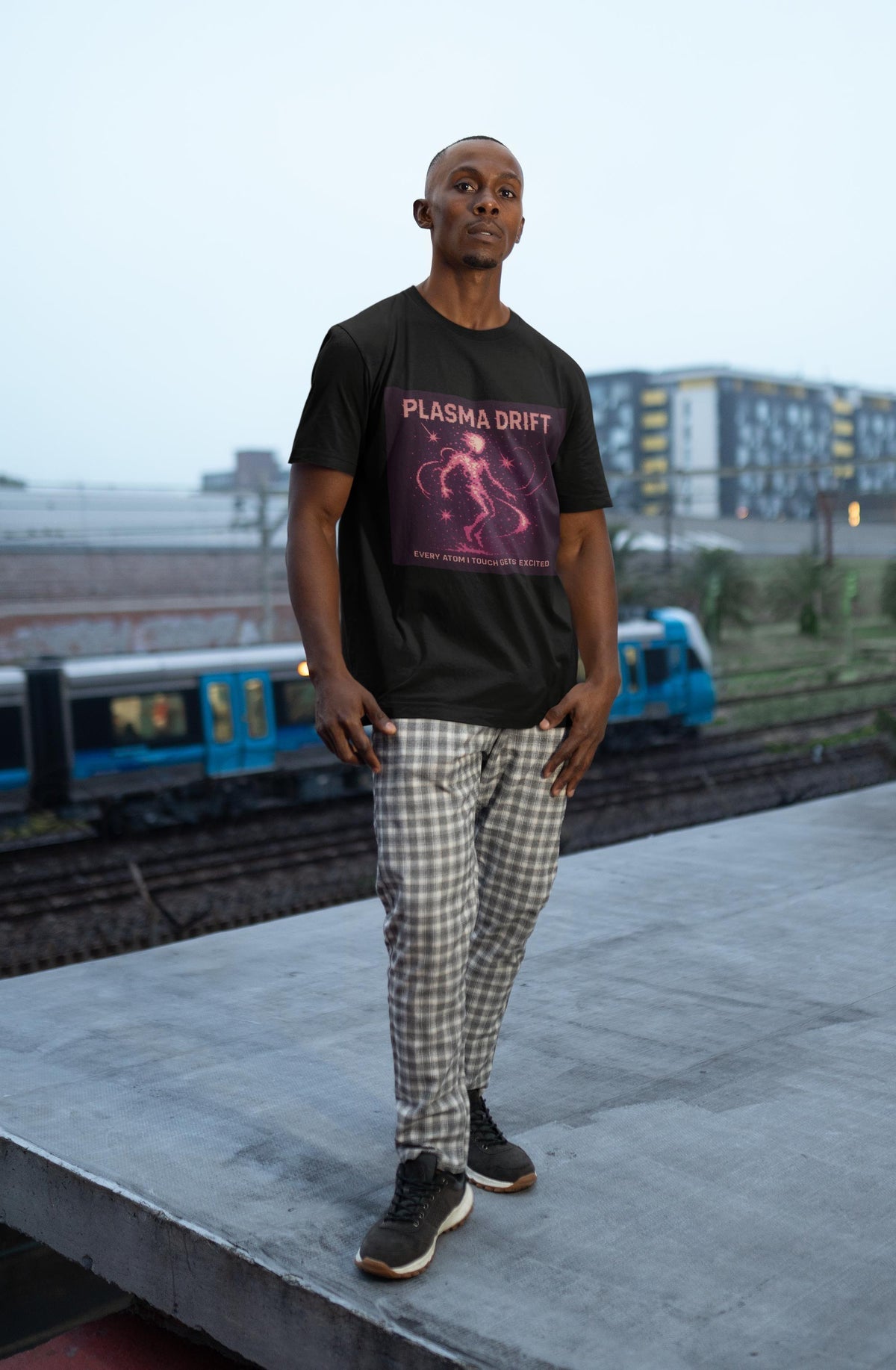 Black Plasma Drift physics T-shirt, pixel-art plasma, ionized gas design, worn by a man