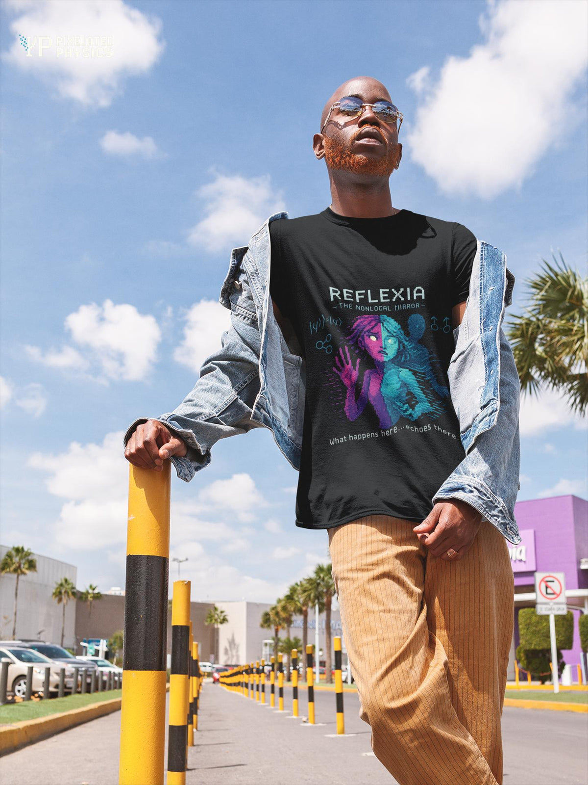Black Reflexia physics T-shirt, pixel-art quantum nonlocality design, worn by a man