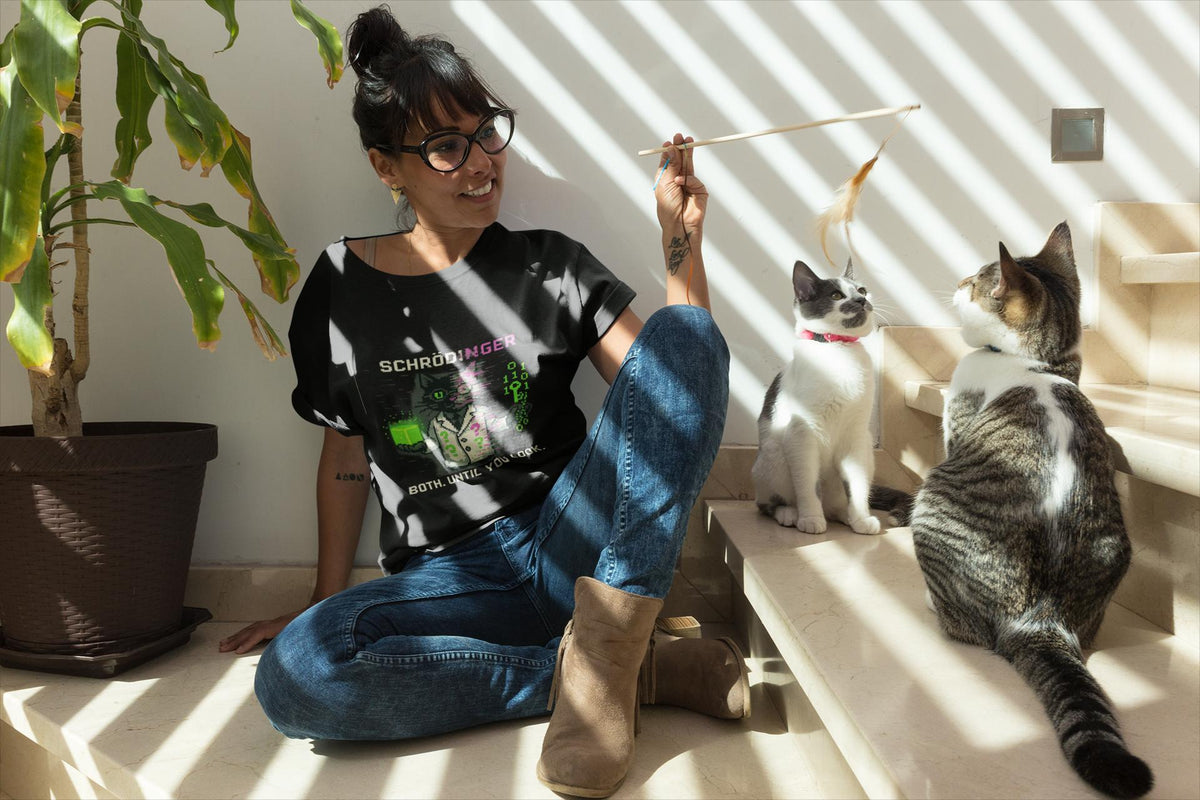 Black Schrödy physics T-shirt, pixel-art Schrödinger’s cat design, worn by a man with cats