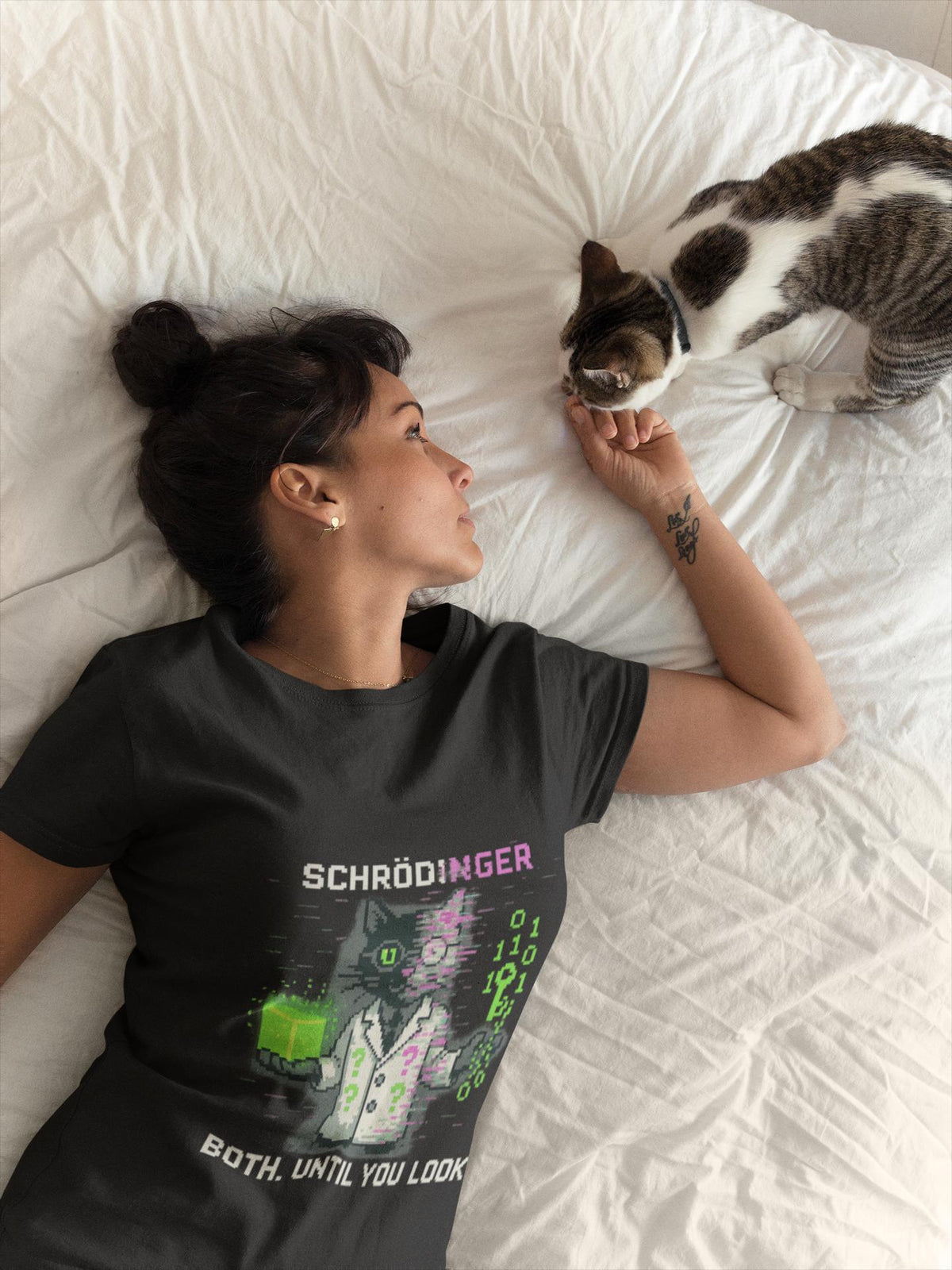 Black Schrödy physics T-shirt, pixel-art Schrödinger’s cat design, worn by a woman with a cat