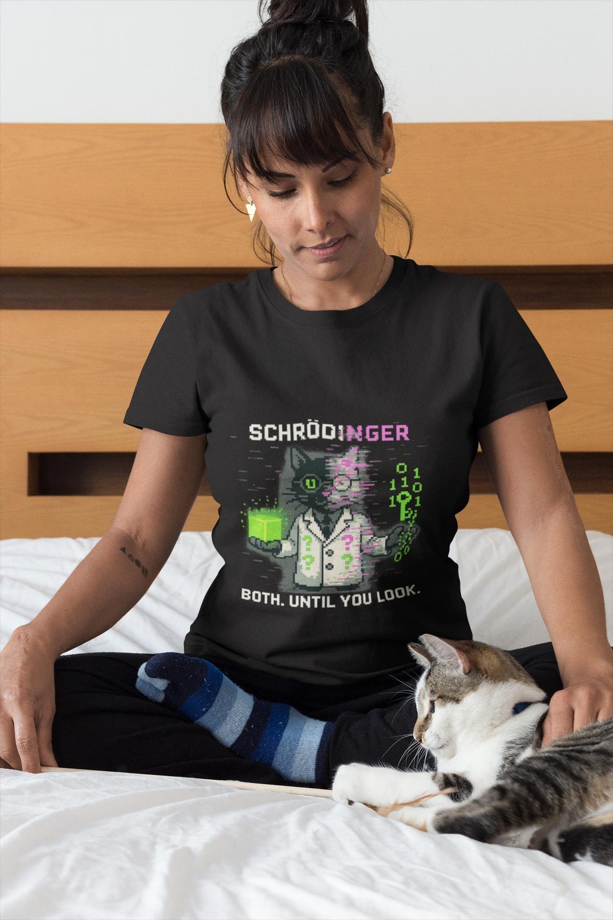 Black Schrödy physics T-shirt, pixel-art Schrödinger’s cat design, worn by a woman with a cat
