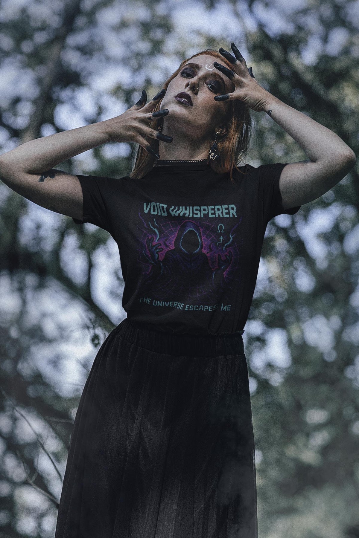 Black Void Whisperer physics T-shirt, pixel-art dark energy design, worn by a woman