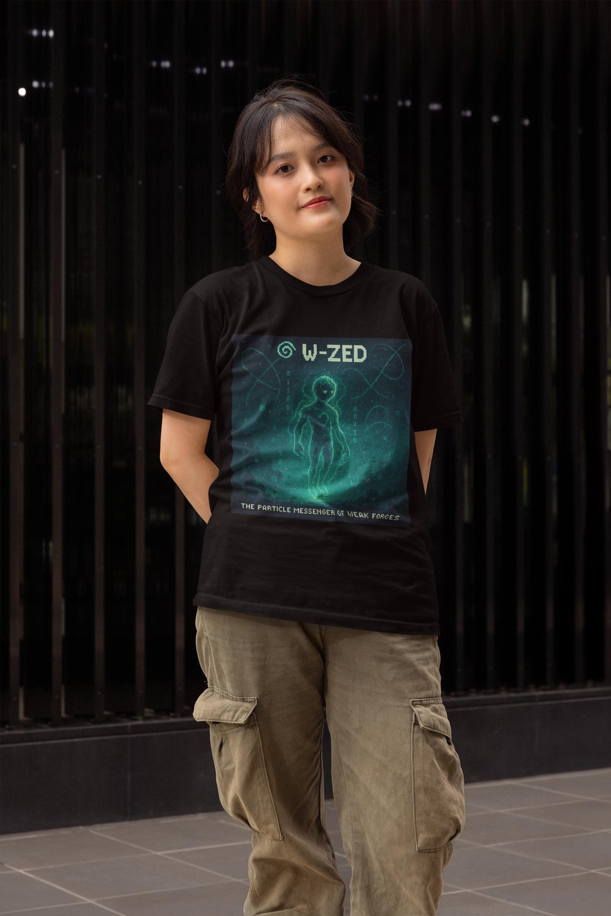 Black W-ZED physics T-shirt, pixel-art W and Z bosons, weak force design, worn by a man