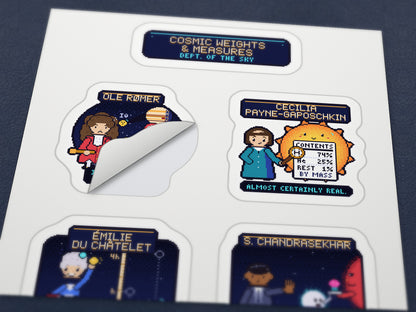 Cosmic Weights & Measures pixel-art physics sticker sheet – close-up of one sticker being peeled off