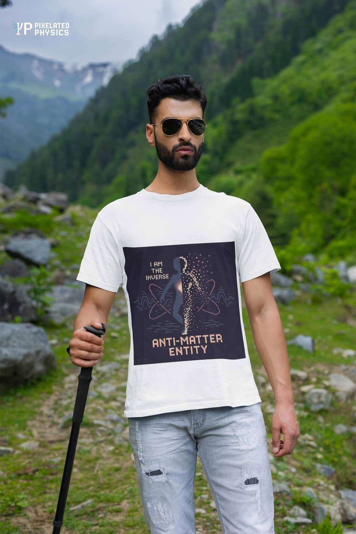 White Anti-Matter Entity physics T-shirt, pixel-art matter–antimatter annihilation design, worn by a man outdoors