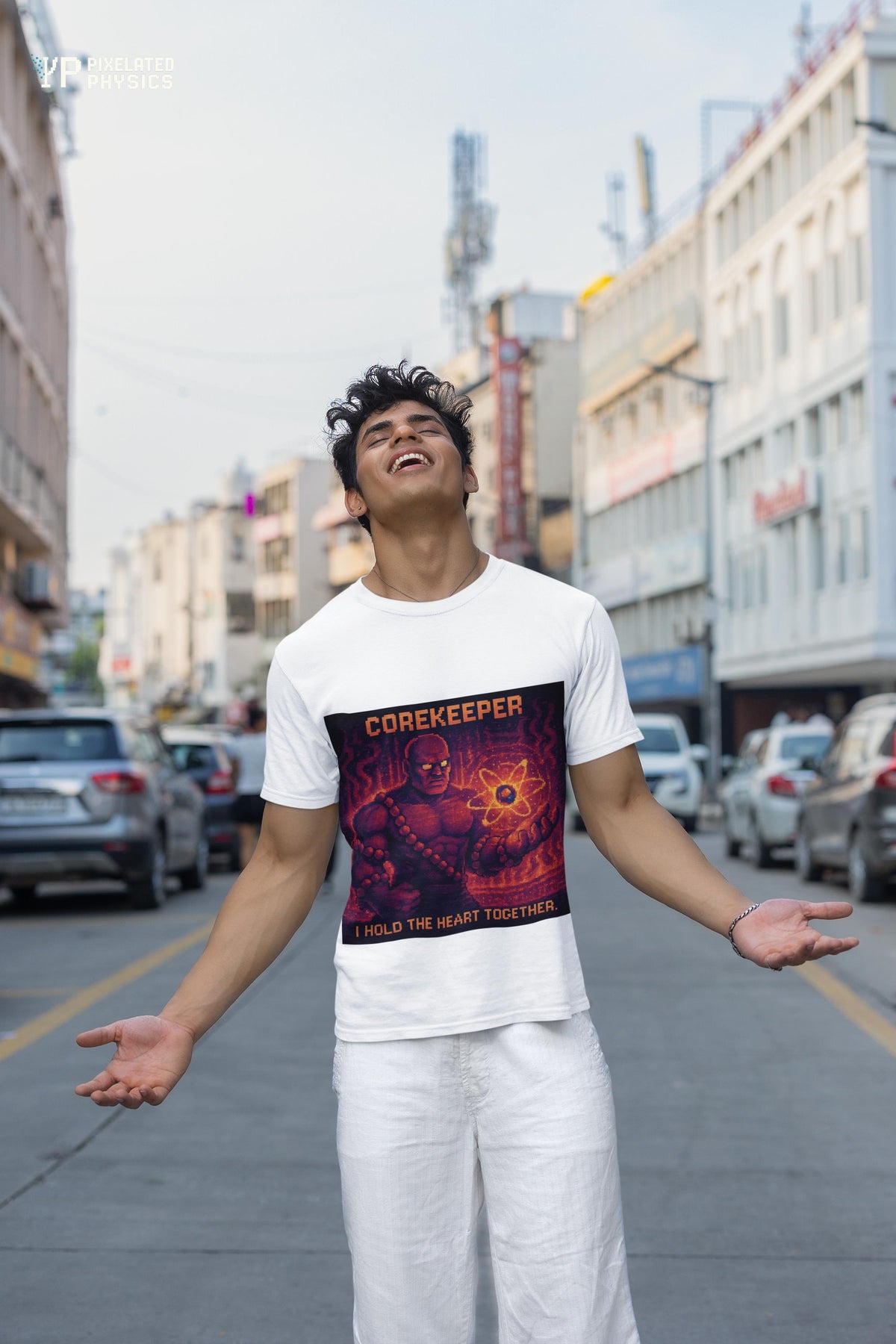 White Corekeeper physics T-shirt, pixel-art strong nuclear force design, worn by a man