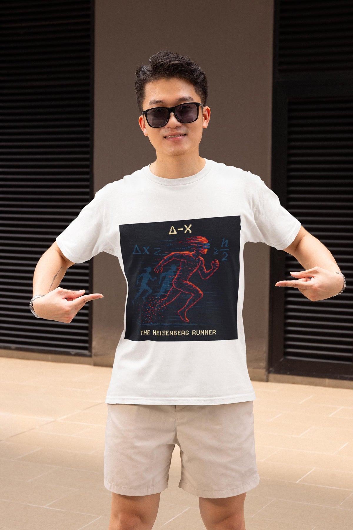 White Δ-X physics T-shirt, pixel-art Heisenberg uncertainty design, worn by a man