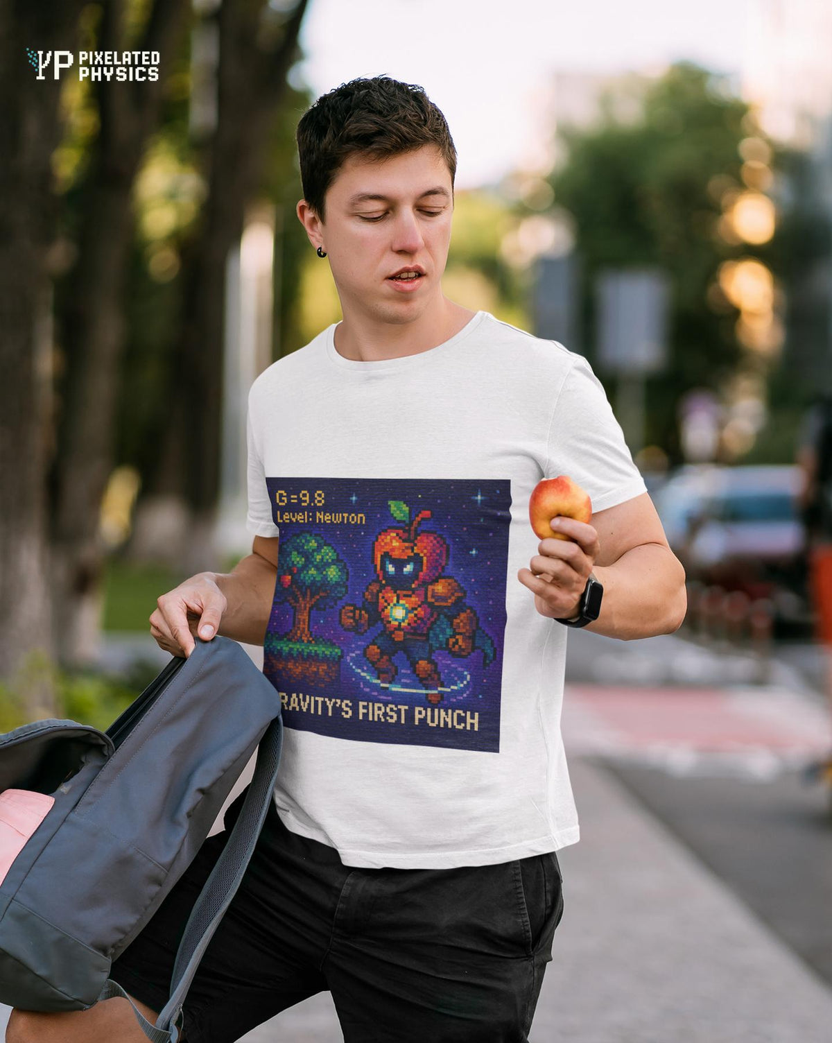 White Gravity's First Punch physics T-shirt, pixel-art Newton’s law of gravitation design, worn by a man