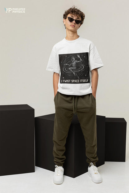 White I Twist Space Itself physics T-shirt, pixel-art gravitational lensing design, worn by a man