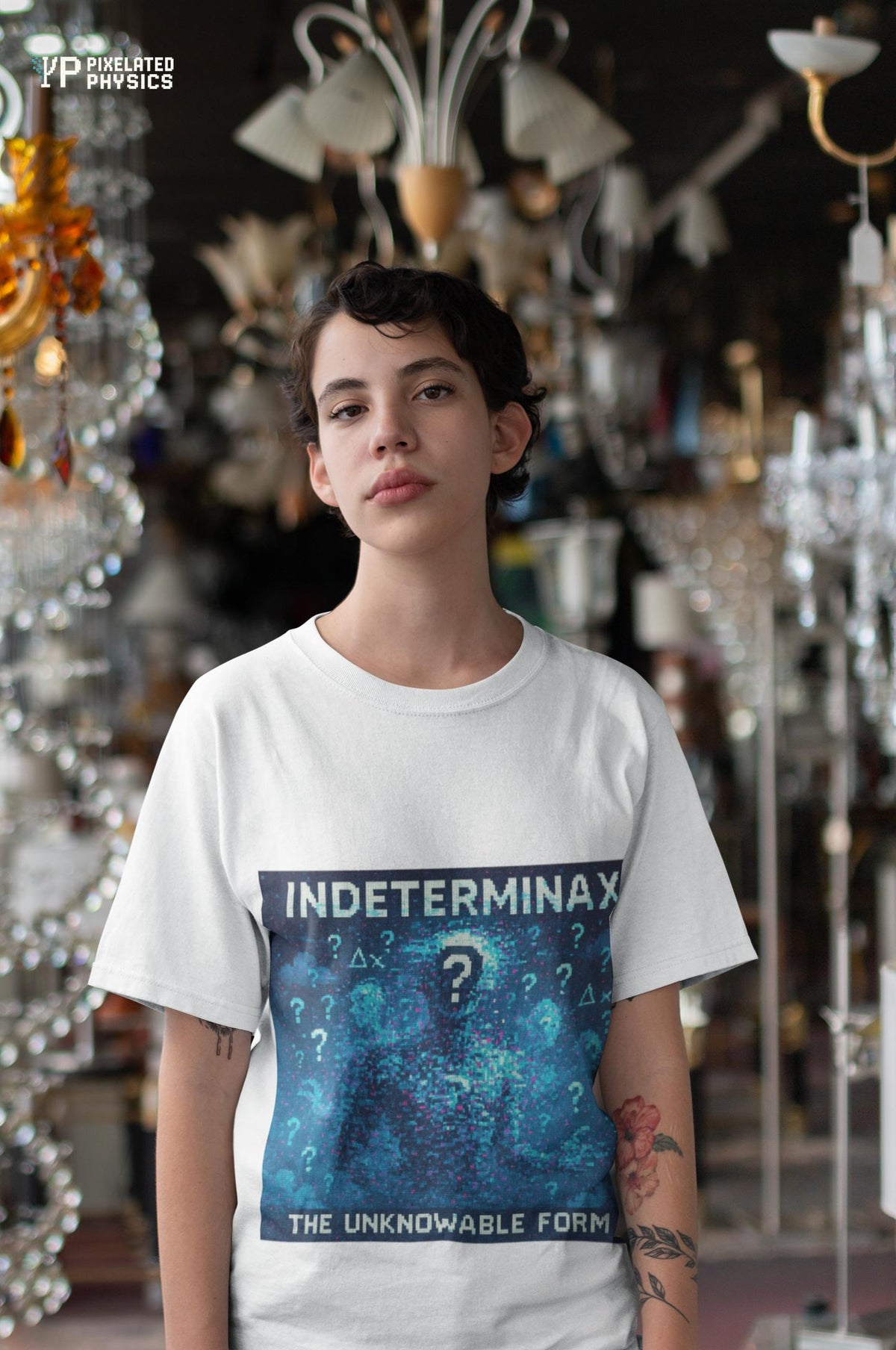 White Indeterminax physics T-shirt, pixel-art uncertainty principle design, worn by a man