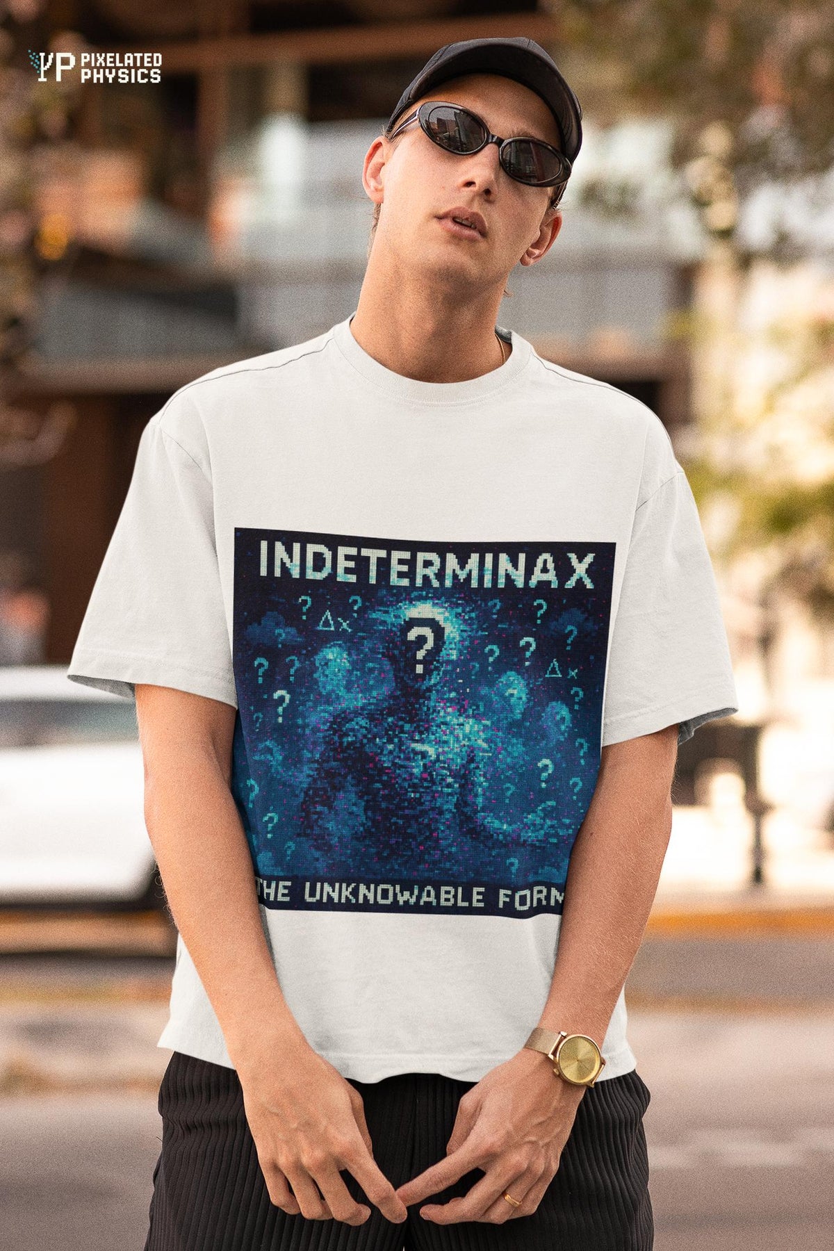 White Indeterminax physics T-shirt, pixel-art uncertainty principle design, worn by a man