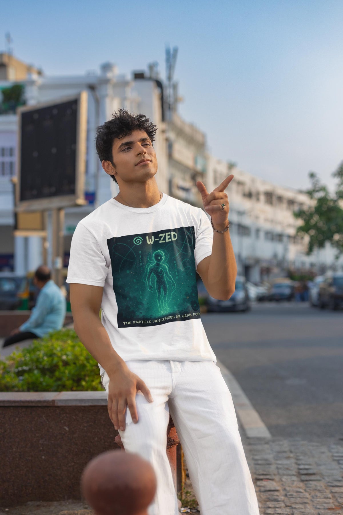 White W-ZED physics T-shirt, pixel-art W and Z bosons, weak force design, worn by a man